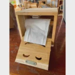 The Artisan Smiley Sentinel – Handcrafted Solid Teak Vertical Tissue Gallery