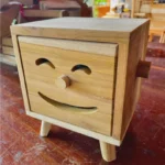 The Artisan Smiley Sentinel – Handcrafted Solid Teak Vertical Tissue Gallery